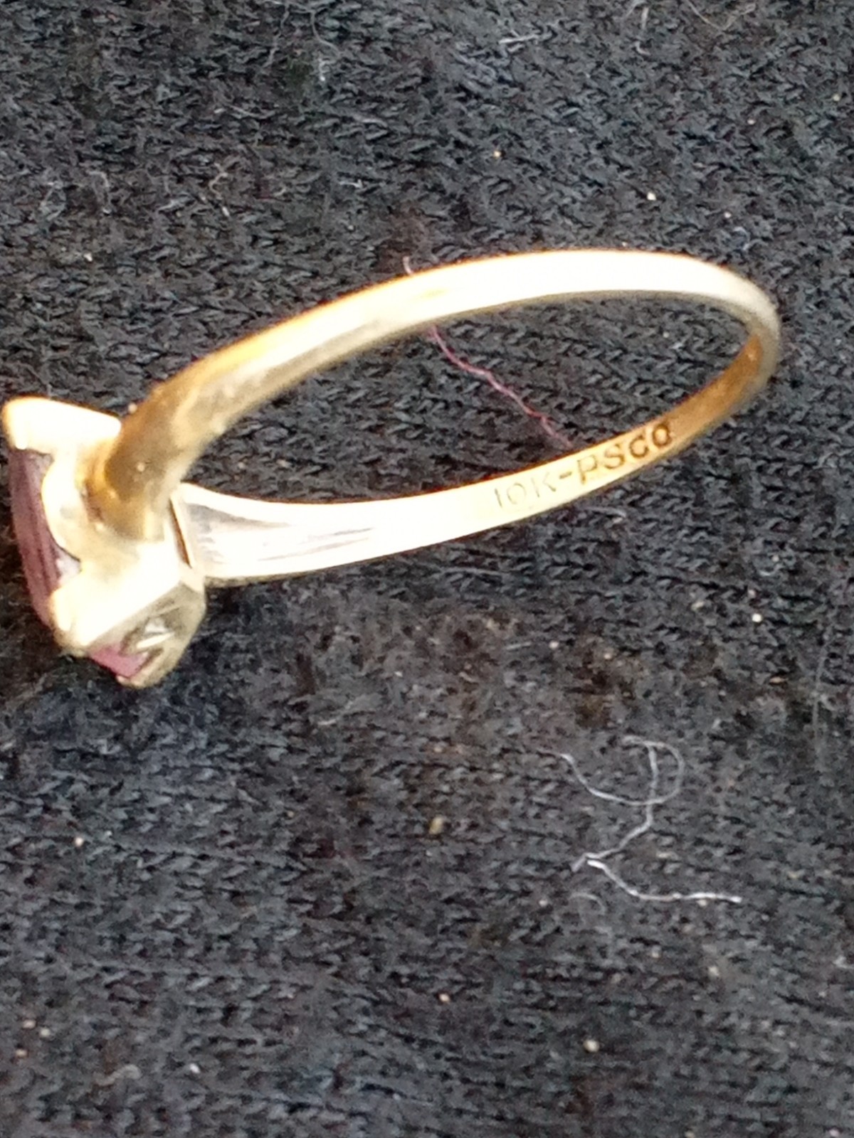 a vintage gold ring with a pink stone